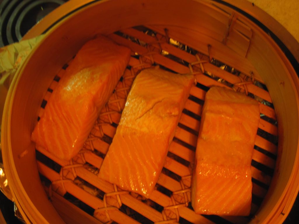 Salmon in steamer skin side down